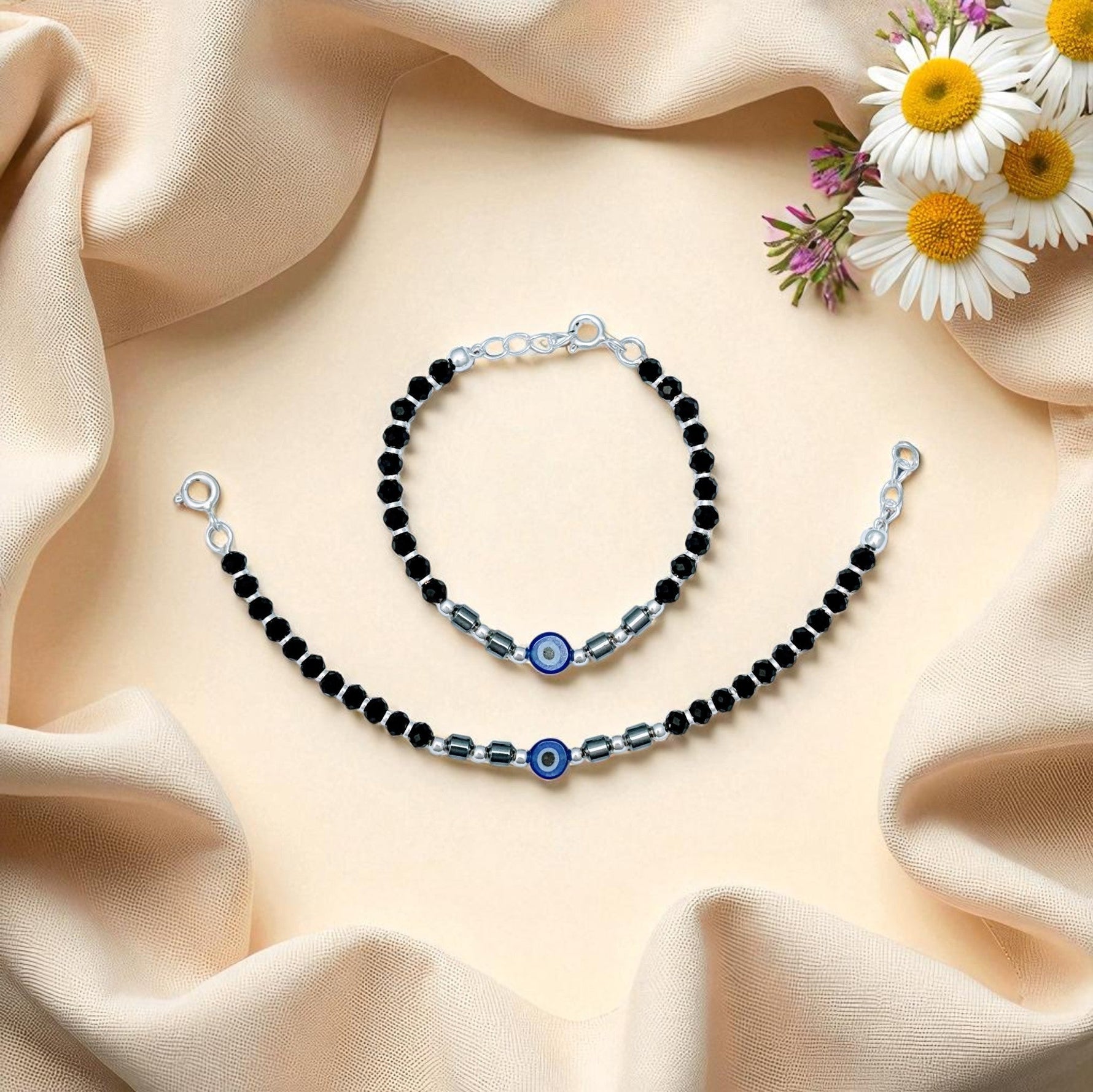 925 sterling silver nazariya bracelet with black beads and adjustable chain for babies to protect against evil eye and negative energy.