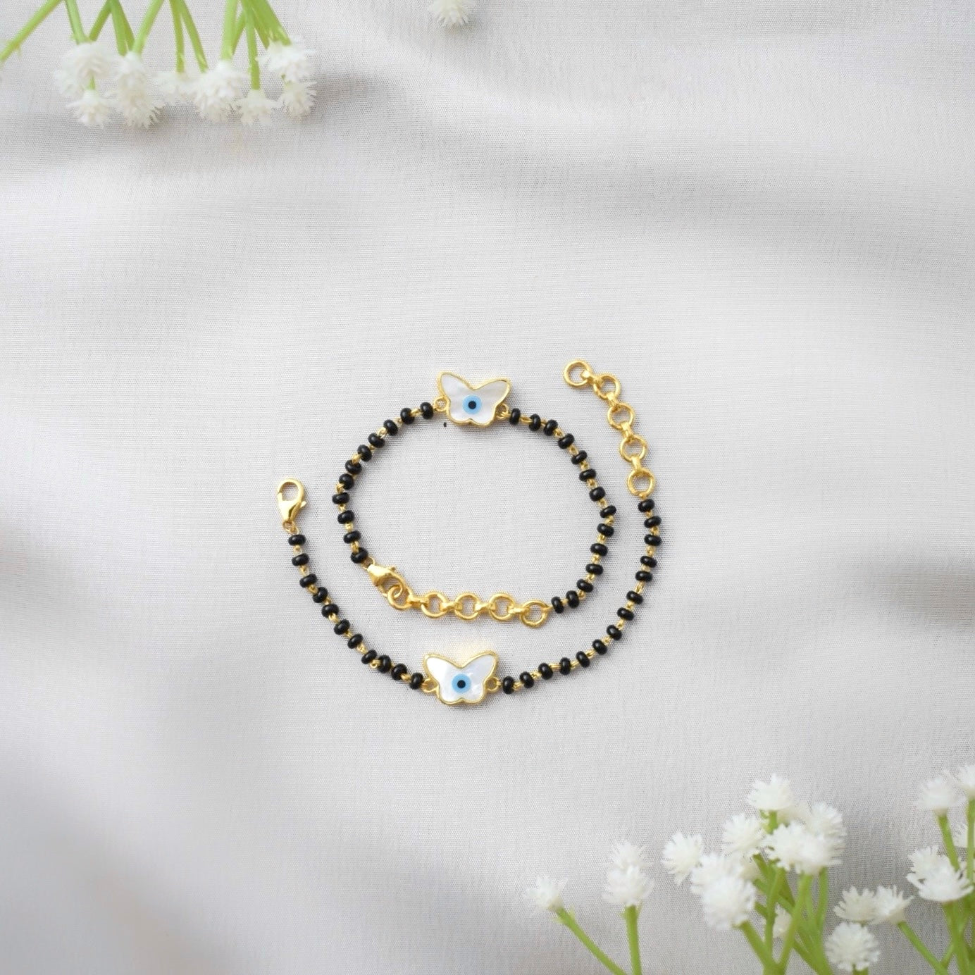 FlyGuard Nazariya – Butterfly & Evil Eye Protection with Black Beads