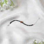 RudraRaksha Nazariya – Black Beads Bracelet with Sacred Rudraksh Charm