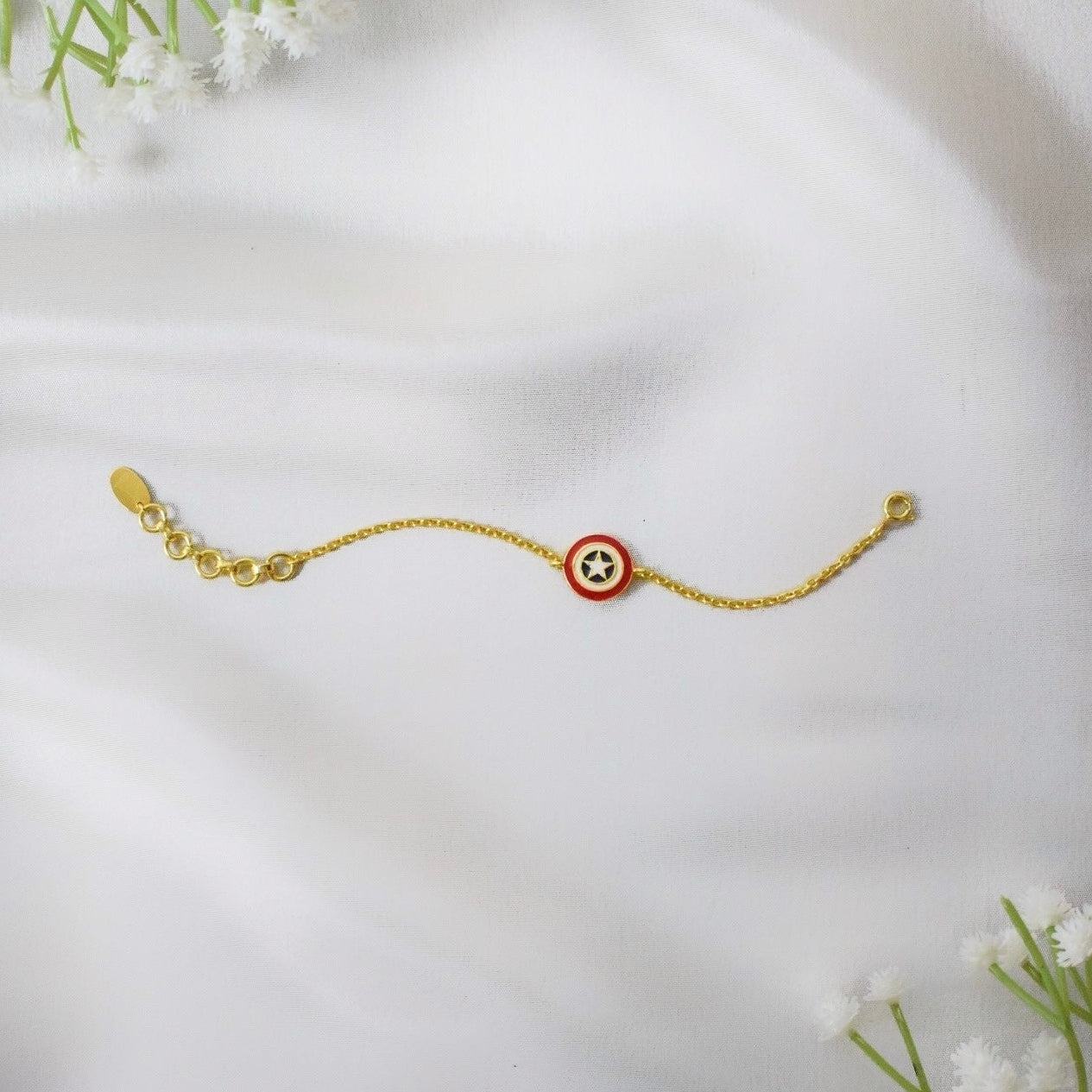 Gold bracelet with a captain america charm