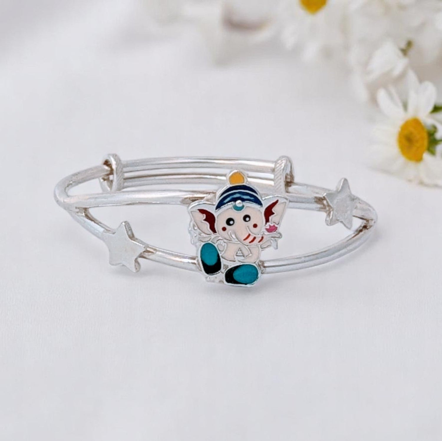 silver bracelet with smooth edges, black beads, and safe clasp, blending tradition with modern comfort and safety.