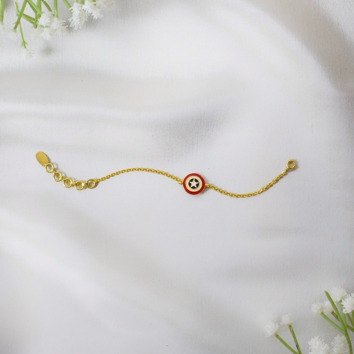 Gold bracelet with a captain america charm